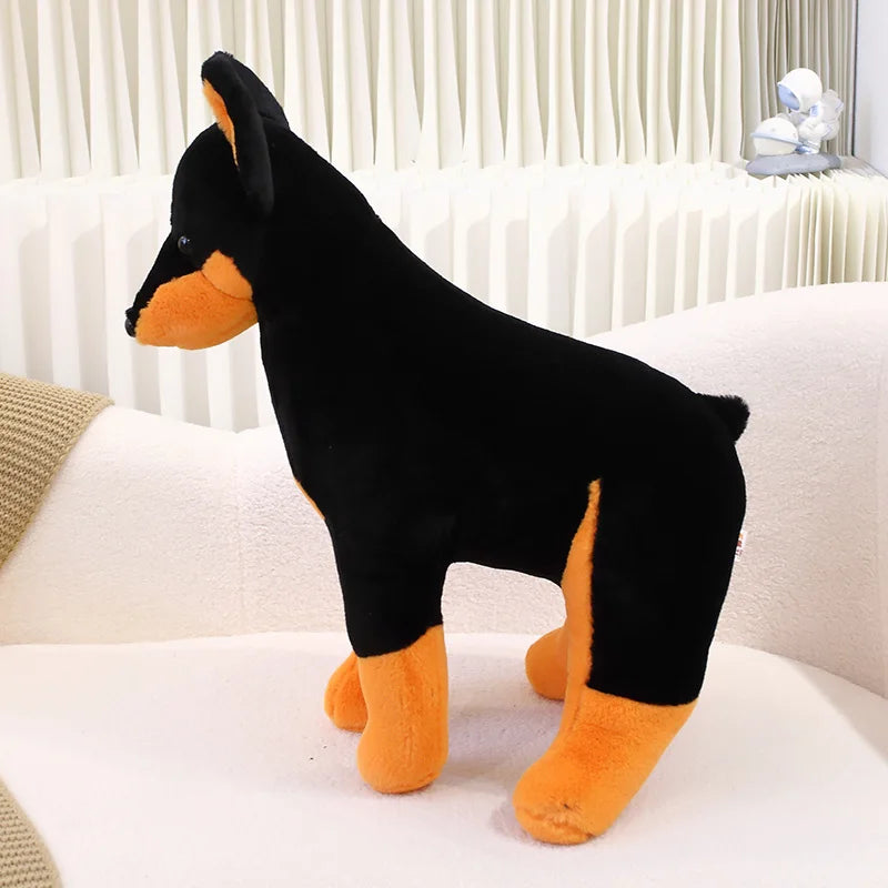 Wachsame Dobermann-Kuschelfigur