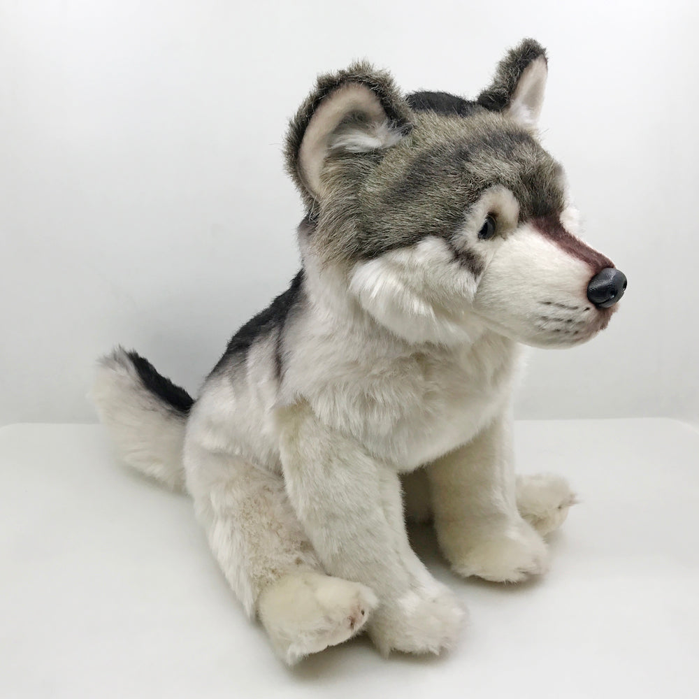 Grauer wolf kuscheltier