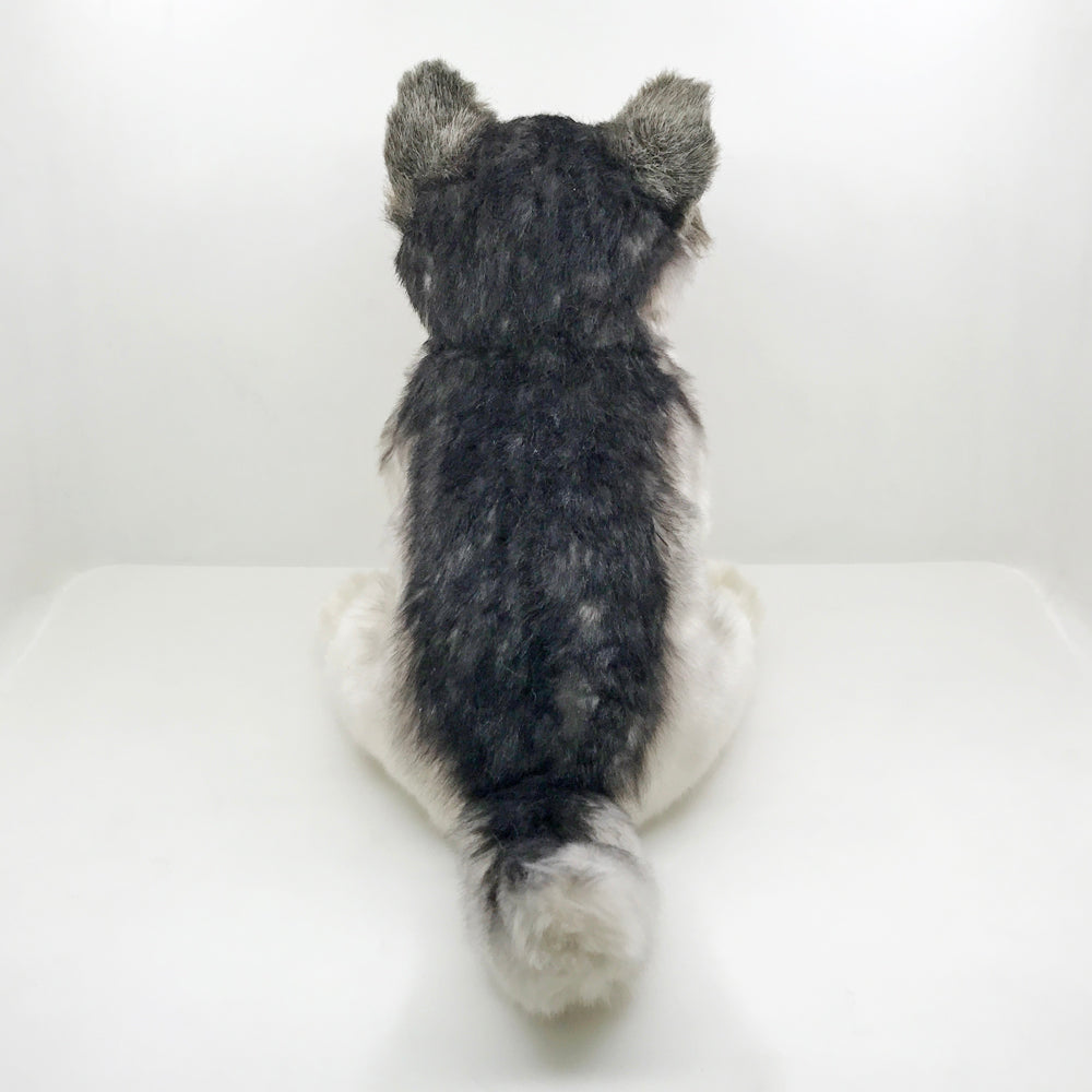 Grauer wolf kuscheltier
