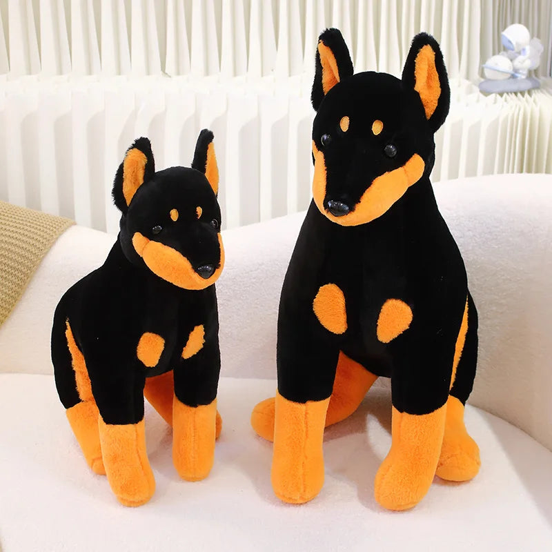 Wachsame Dobermann-Kuschelfigur