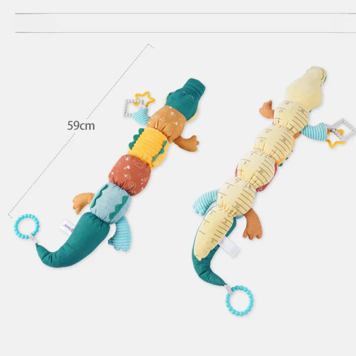 Sensorische plüschrassel und musik-krokodil