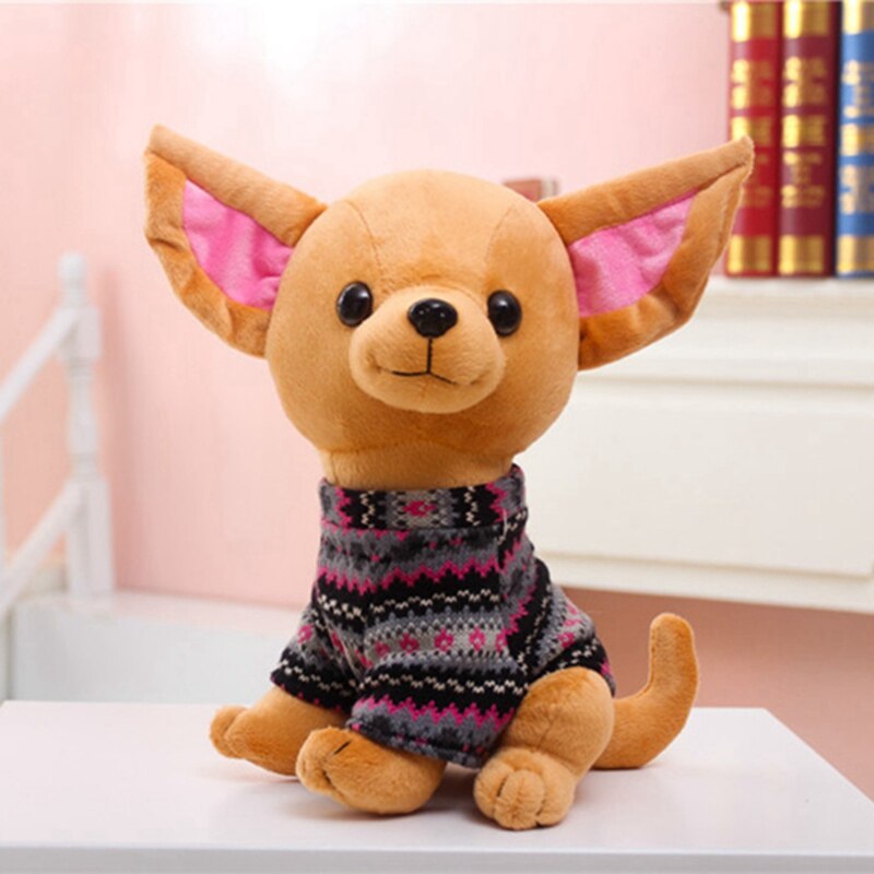 Image of two sitting Chihuahua stuffed animals that look like they're kissing